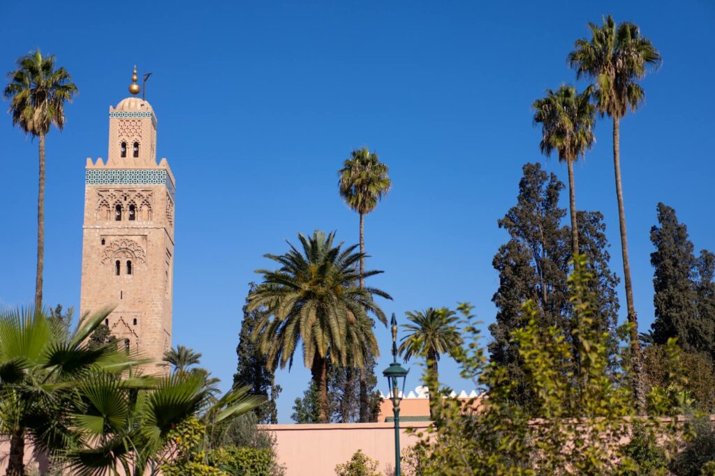 View of a nearby mosque (Arabic religious place) from one of the parks in Marrakesh.