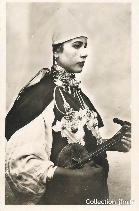 black and white old photo of a Moroccan lady