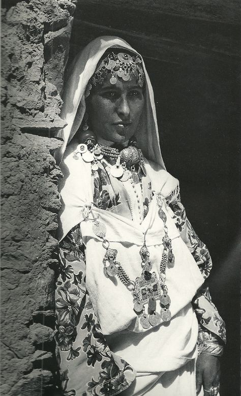 black and white old photo of a Moroccan lady